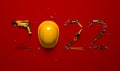 `2022` made from a set of construction tools and a protective helmet on a red background.