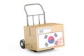 Made in South Korea concept. Cardboard Box on Hand Truck, 3D rendering Royalty Free Stock Photo