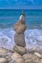 Made of stone tower on the beach. Balanced pebbles on beach Royalty Free Stock Photo