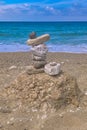 Made of stone tower on the beach. Balanced pebbles on beach Royalty Free Stock Photo