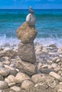 Made of stone tower on the beach. Balanced pebbles on beach Royalty Free Stock Photo