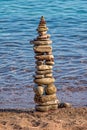 Made of stone tower on the beach. Balanced pebbles on beach Royalty Free Stock Photo