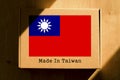 Made in Taiwan. Cardboard boxes with text `Made In Taiwan` and the Flag of Taiwan.