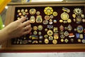 Made in Ukraine medals of honor and orders presented on a stand, woman hand touching one of them