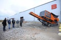 Made in Ukraine stone crusher machine parked in front of the entrance of the hangar