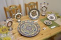 Made in Ukrainian traditional style crockery placed on a stand during exhibition. Ukrainian Christmas decorations fair