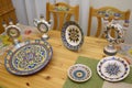 Made in Ukrainian traditional style painted crockery placed on a table. Kyiv, Ukraine