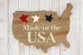 Made in the USA message with stars on weathered wood USA map Royalty Free Stock Photo