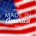 Made in usa over defocused United States flag background Royalty Free Stock Photo