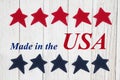 Made in the USA text with patriotic red and blue stars Royalty Free Stock Photo