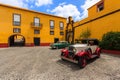 Classis cars on courtyard of castle in Funchal town, Madeira