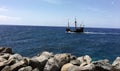 Pirate sailboat sailing in the bay