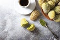 Madeleine homemade cookies with matcha tea. Selective focus, copy space