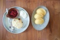 Madeleine or Madeleines and scone , cranberry scone or scone with whipped cream and berry sauce