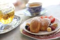 Madeleines, French sweet dessert with fruits and tea