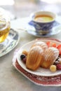 Madeleines , French sweet dessert with fruits and tea