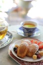 Madeleines , French sweet dessert with fruits and tea