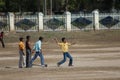 Boys playing criket in the town of Umaria. Royalty Free Stock Photo