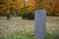 Tombstone and graves in an ancient church graveyard Royalty Free Stock Photo