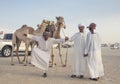 Man with camels at the million street where camels are being bought and sold