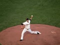 Madison Bumgarner steps forward to throws pitch