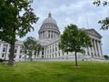 Madison Wisconsin State Capitol building with green grass and trees in the background Royalty Free Stock Photo