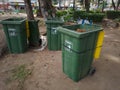 Madiun, East Java, Indonesia - September 23, 2022: Group of Plastic Waste Bins with Different Types of Waste Separation to reduce