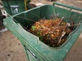 Madiun, East Java, Indonesia - September 23, 2022: Group of Plastic Waste Bins with Different Types of Waste Separation to reduce