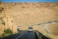 Madkhal Meski, Morocco - April 12, 2015. Silver vintage off road car going on the new tar road around Ziz Valley