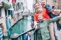 Madly happy family take a selfie photo on the one of bridge in V