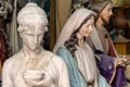 sculptures of madonna and christ in artist studio close up