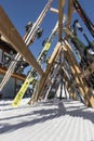 MADONNA DI CAMPIGLIO, ITALY - JANUARY 26, 2023. Skis and snowboards resting on a wooden stand. View inside the stand