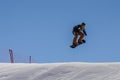 MADONNA DI CAMPIGLIO TN, ITALY, APRIL 9, 2017. Snowboarder enjoying jumps and runs