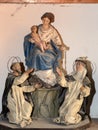 Sculptures of Madonna with saints at an exhibition in the artist studio