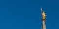 Madonnina golden statue of Virgin Mary on top of Milan Gothic Cathedral, Italy Royalty Free Stock Photo