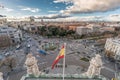 Madrid skyline cloudy sunset view from Cibeles Palace Townhall, big spanish flag Madrid City Council building