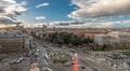 Madrid skyline view, motion blurred vehicles, people and big spanish flag from from Cibeles Palace Townhall Royalty Free Stock Photo