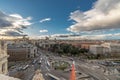 Madrid skyline view, motion blurred vehicles, people and big spanish flag from from Cibeles Palace Townhall.