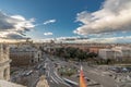 Madrid skyline view, motion blurred vehicles, people and big spanish flag from from Cibeles Palace Townhall.