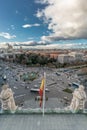 Madrid skyline view, motion blurred vehicles, people and big spanish flag from from Cibeles Palace Townhall. Royalty Free Stock Photo