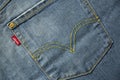 MADRID, SPAIN - APRIL 3, 2022: Close up of the back pocket of a pair of Levi`s jeans with the classic embroidery and label of the Royalty Free Stock Photo