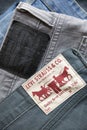 MADRID, SPAIN - APRIL 3, 2022: Close up of the back of various Levi`s jeans. Detail of different labels with the logo of the worl Royalty Free Stock Photo