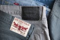 MADRID, SPAIN - APRIL 3, 2022: Close up of the back of various Levi`s jeans. Detail of different labels with the logo of the worl