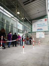 Mature people patients wearing face protective masks waiting in queue for vaccination against covid