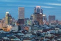 MADRID, SPAIN - APRIL 13, 2019: Skyline of Madrid`s financial district, surrounded by the city`s housing during the sunset, we c Royalty Free Stock Photo