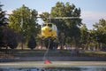 MADRID, SPAIN - AUGUST 3 : Fire rescue heavy helicopter with water bucket, goes to a fire in Madrid on August 3, 2013, Spain. Royalty Free Stock Photo