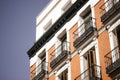 Madrid, Spain. August 1 2022 Red brick building facade balconies apartment house Royalty Free Stock Photo