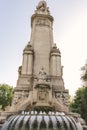 Madrid, Spain - August 8, 2018 view of the Miguel Cervantes Monument, in the background of the Edificio de Espana skyscraper Royalty Free Stock Photo