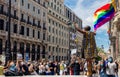 Black woman waving an LGBT flag during the black lives matter protests in Madrid