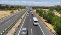 Cars stopping at the start of the traffic jam caused by the start of a holdup due to heavy traffic